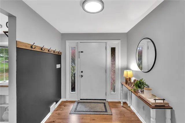a view of a livingroom with furniture and hallway