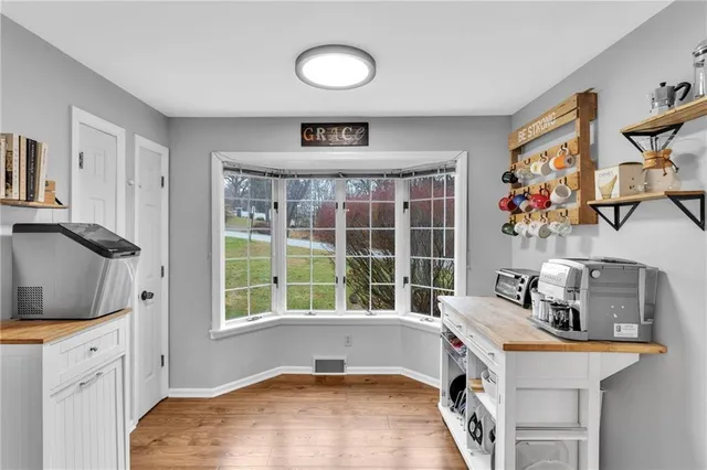 a spacious bedroom with a bed and a window