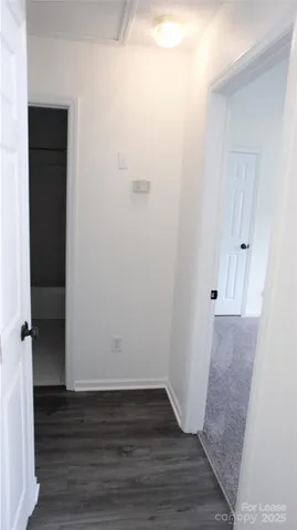 a view of room with wooden floor