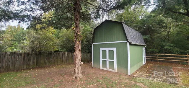 a house with trees in the background