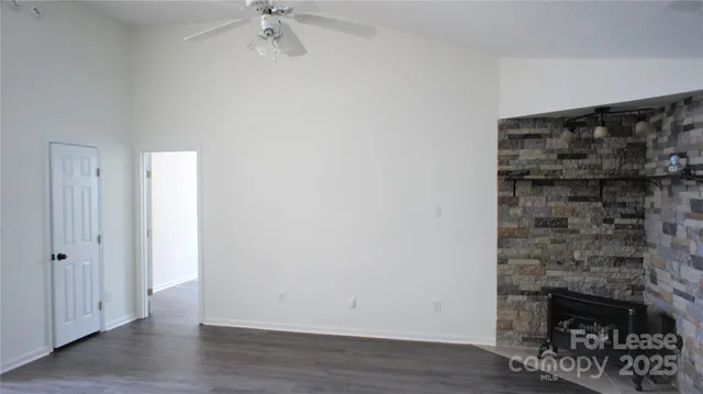 a view of an empty room and wooden floor