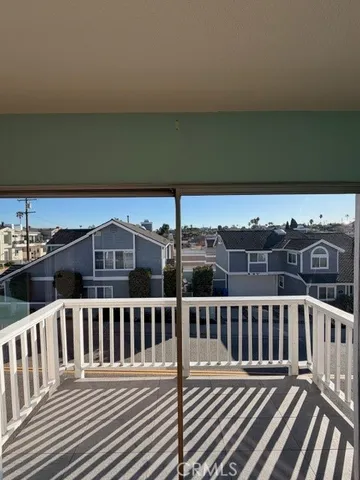 a view of a balcony with wooden floor