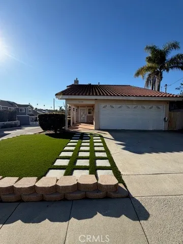 a view of a swimming pool with a yard and plants