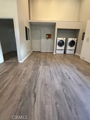 a view of a livingroom with wooden floor