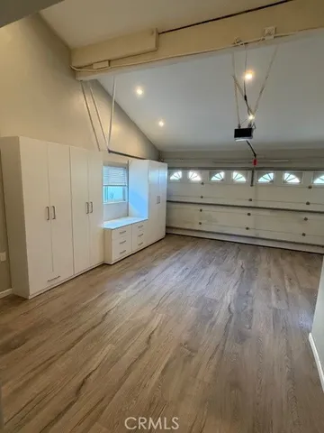 a view of a room with wooden floors