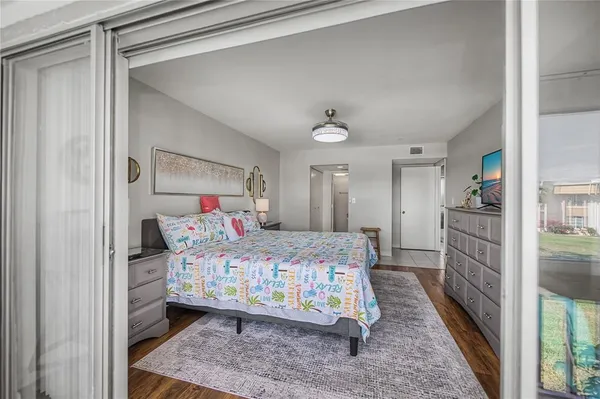 a bedroom with a bed and a view of bedroom