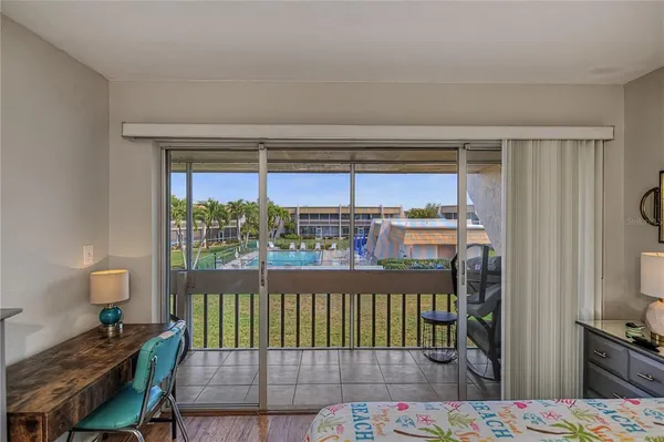 a view of a balcony with furniture
