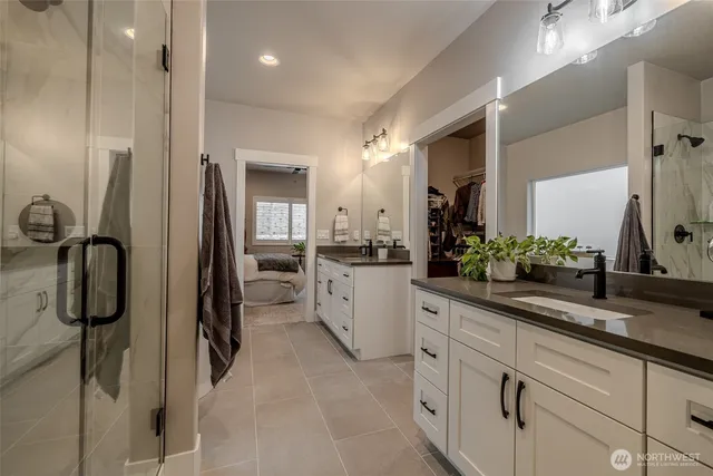 a bathroom with a sink a vanity and mirror