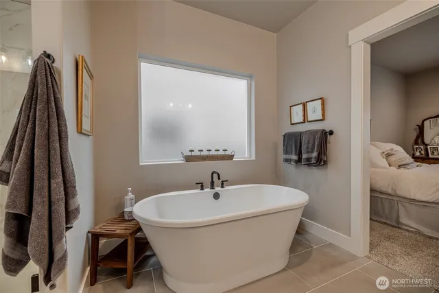 a white bath tub sitting in a bathroom