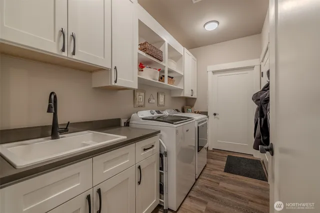 a kitchen with a sink and cabinets