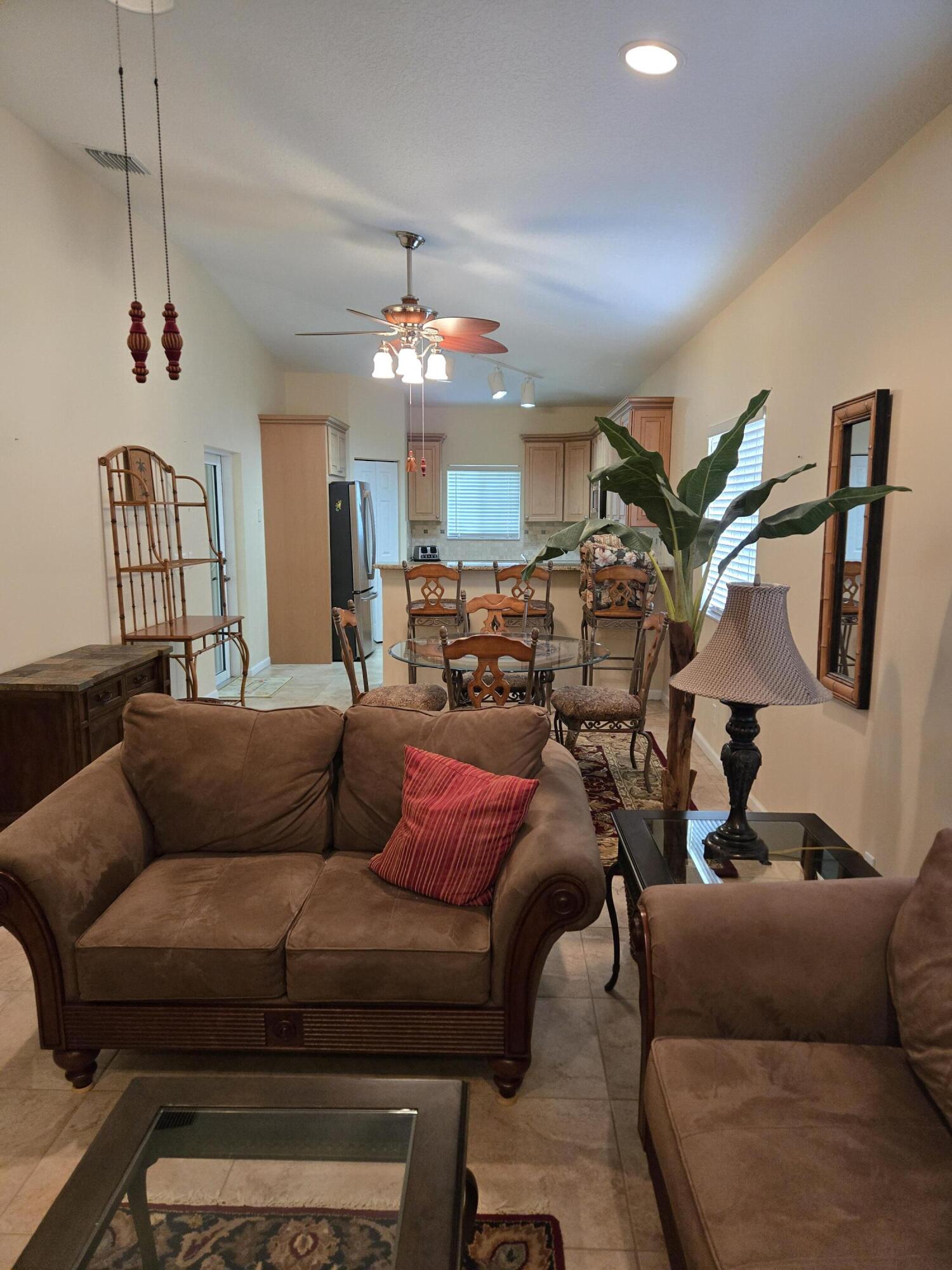 2297 Windjammer Way West Palm Beach, FL 33411 - Photo 18 of 56 a living room with furniture and a chandelier