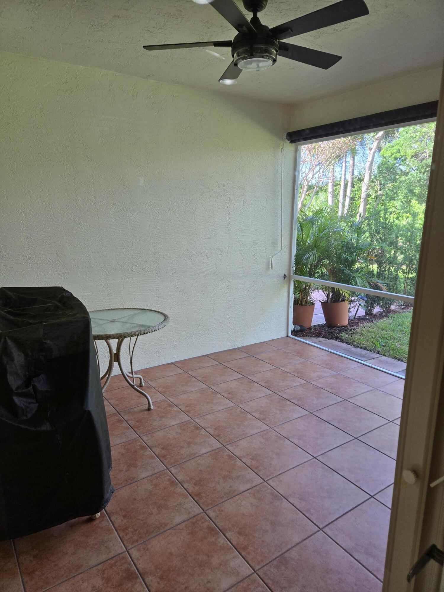 2297 Windjammer Way West Palm Beach, FL 33411 - Photo 24 of 56 a bedroom with a bed and a window