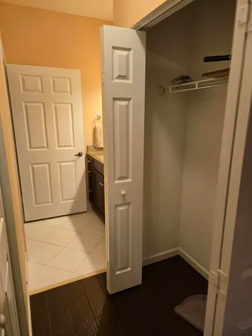 a view of storage and utility room with two washing machine