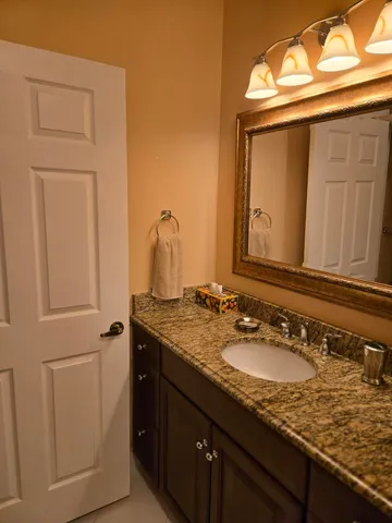 a white toilet sitting next to a sink