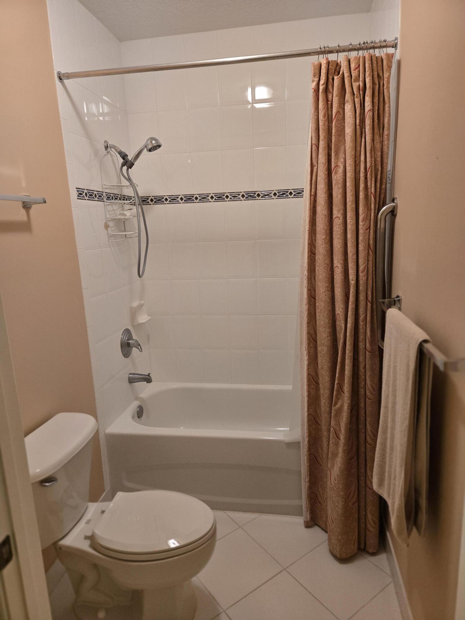 2297 Windjammer Way West Palm Beach, FL 33411 - Photo 32 of 56 a bathroom with a toilet and a shower
