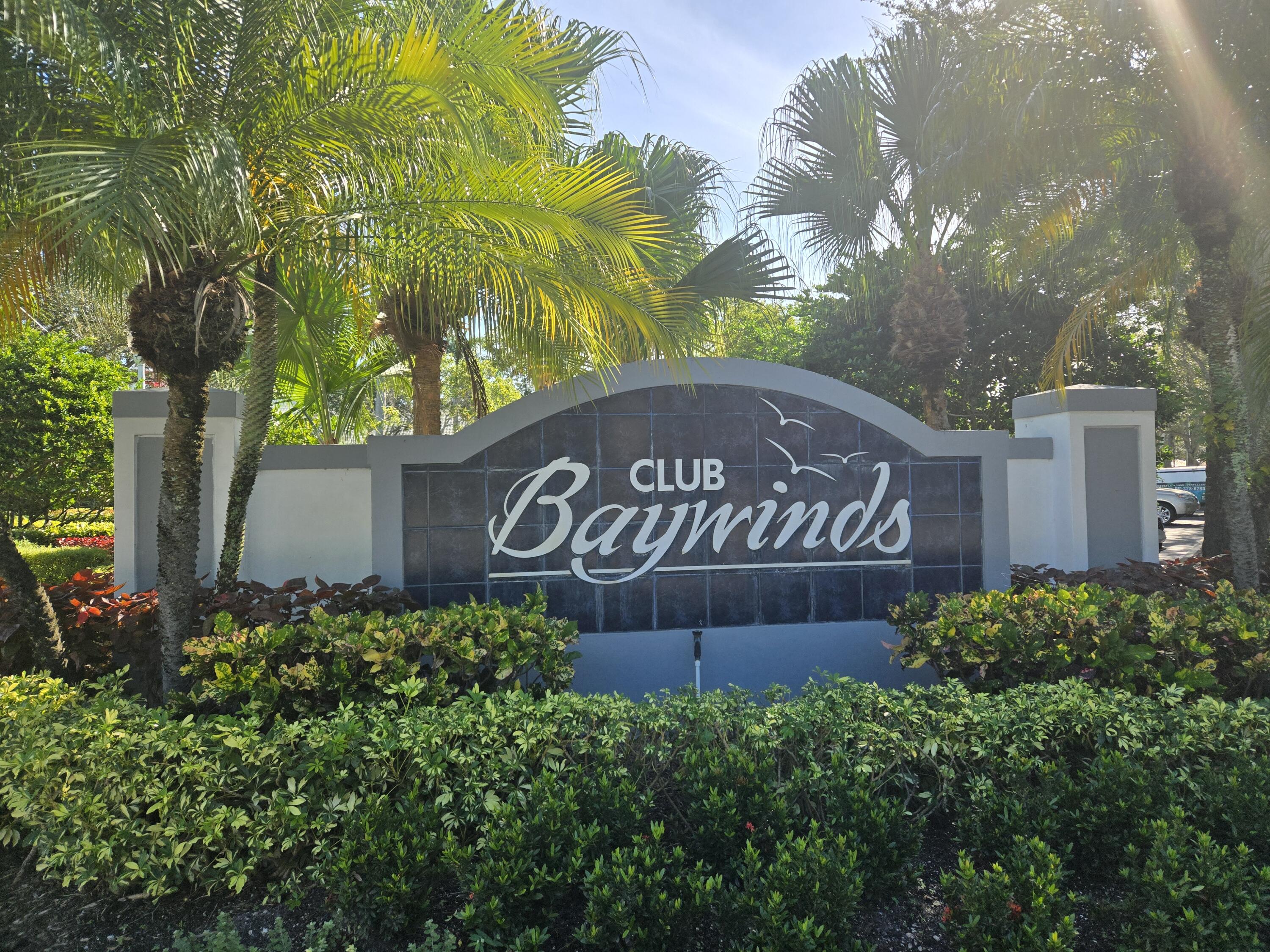 2297 Windjammer Way West Palm Beach, FL 33411 - Photo 35 of 56 a sign broad in front of the red door