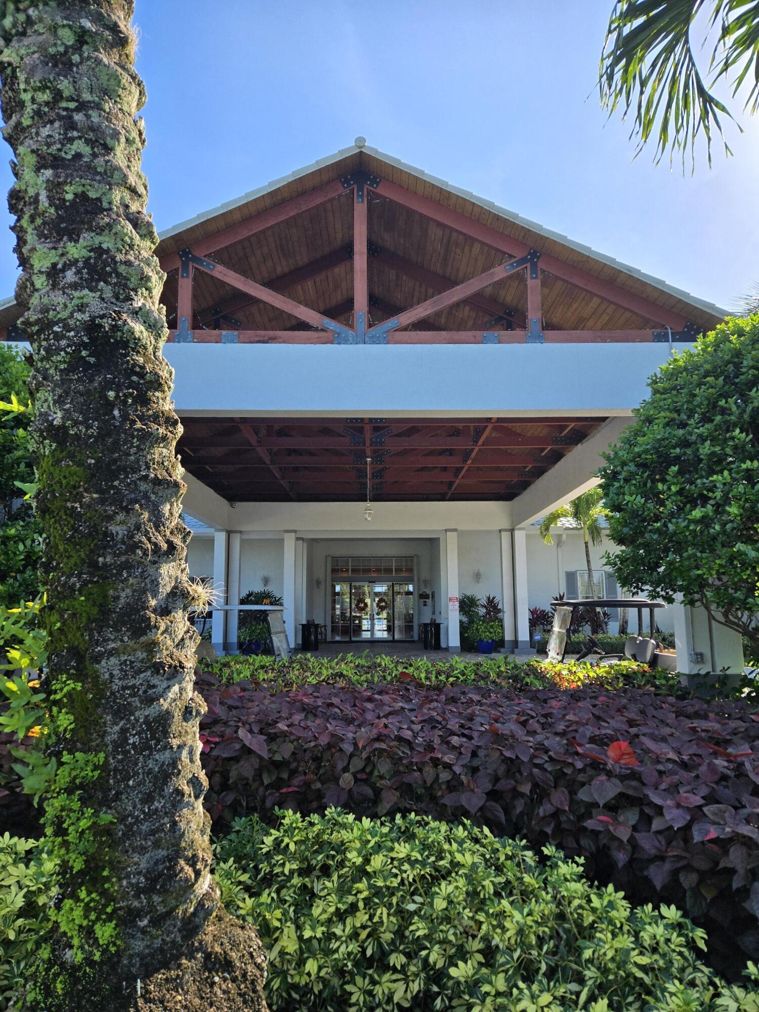 2297 Windjammer Way West Palm Beach, FL 33411 - Photo 37 of 56 a front view of a house with garden