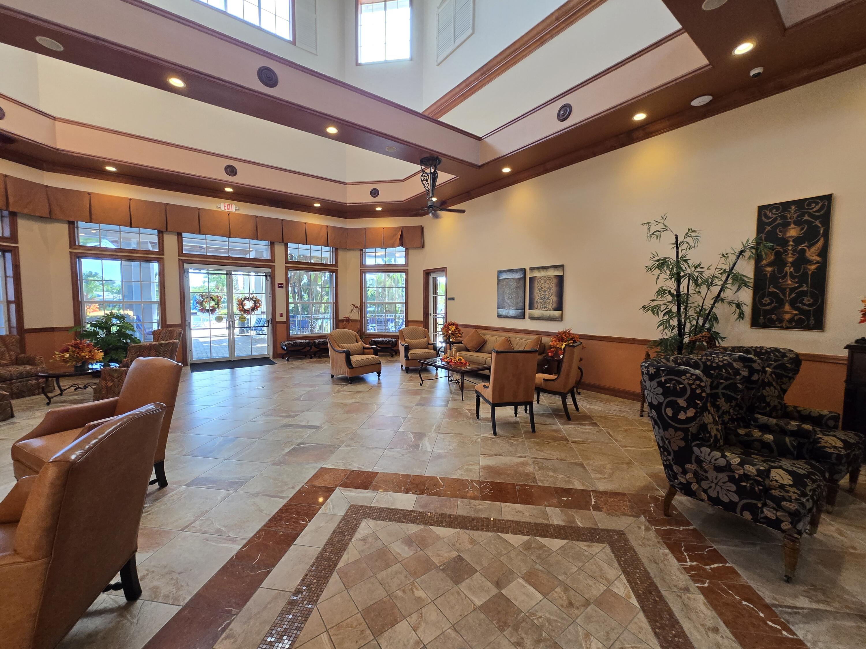 2297 Windjammer Way West Palm Beach, FL 33411 - Photo 39 of 56 a living room with furniture and a large window