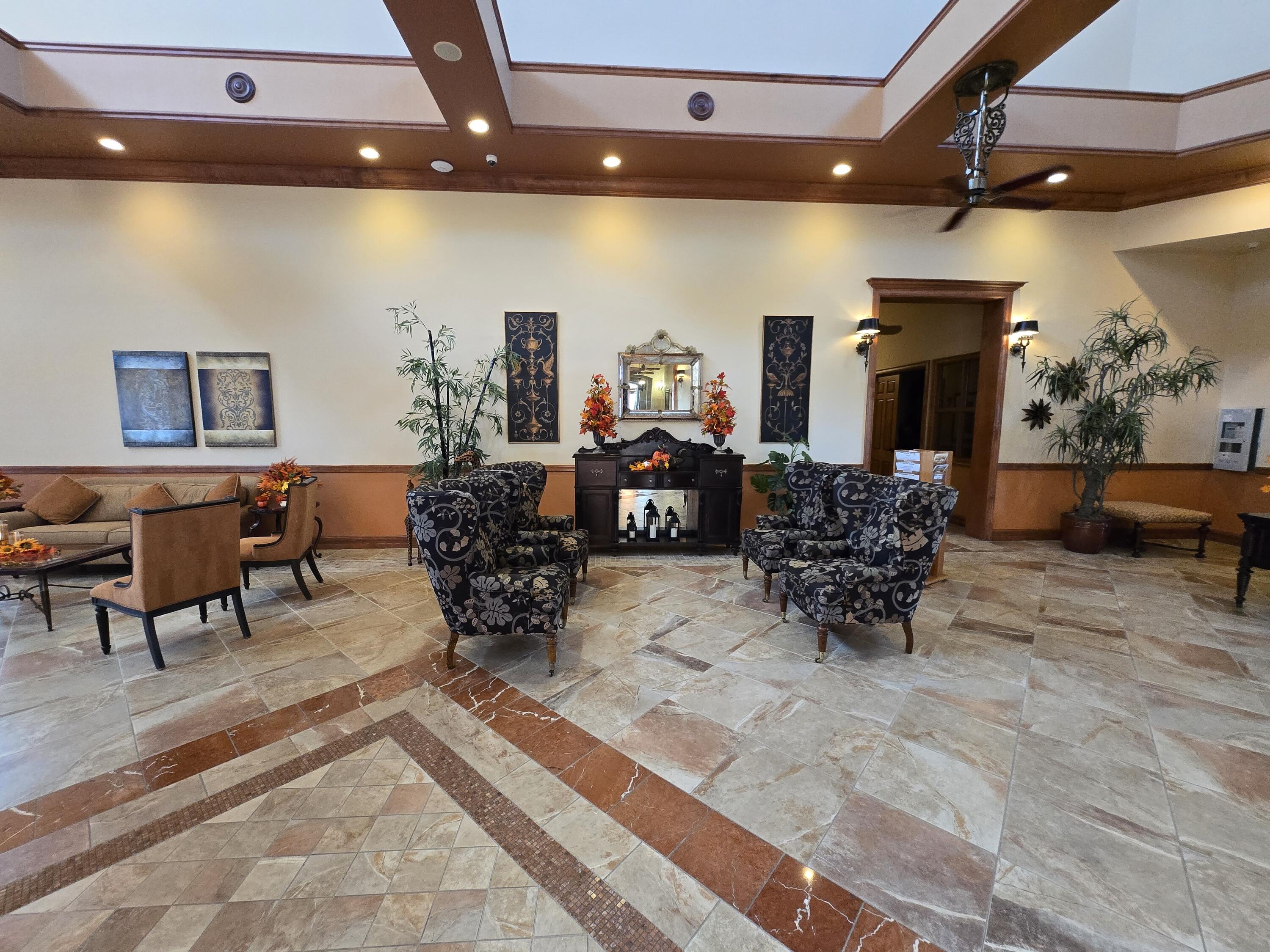 2297 Windjammer Way West Palm Beach, FL 33411 - Photo 40 of 56 a living room with furniture and potted plants