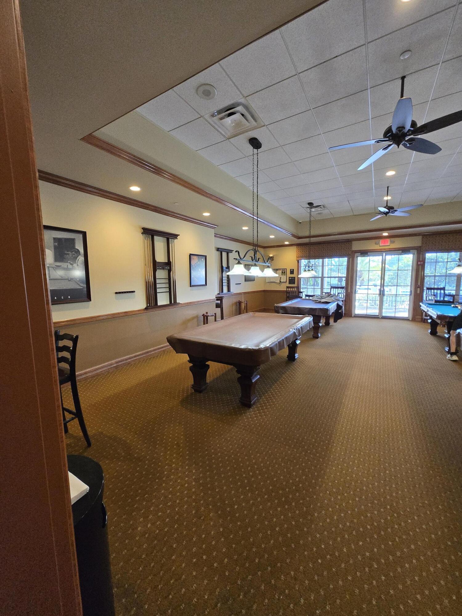 2297 Windjammer Way West Palm Beach, FL 33411 - Photo 43 of 56 a room with pool table and windows