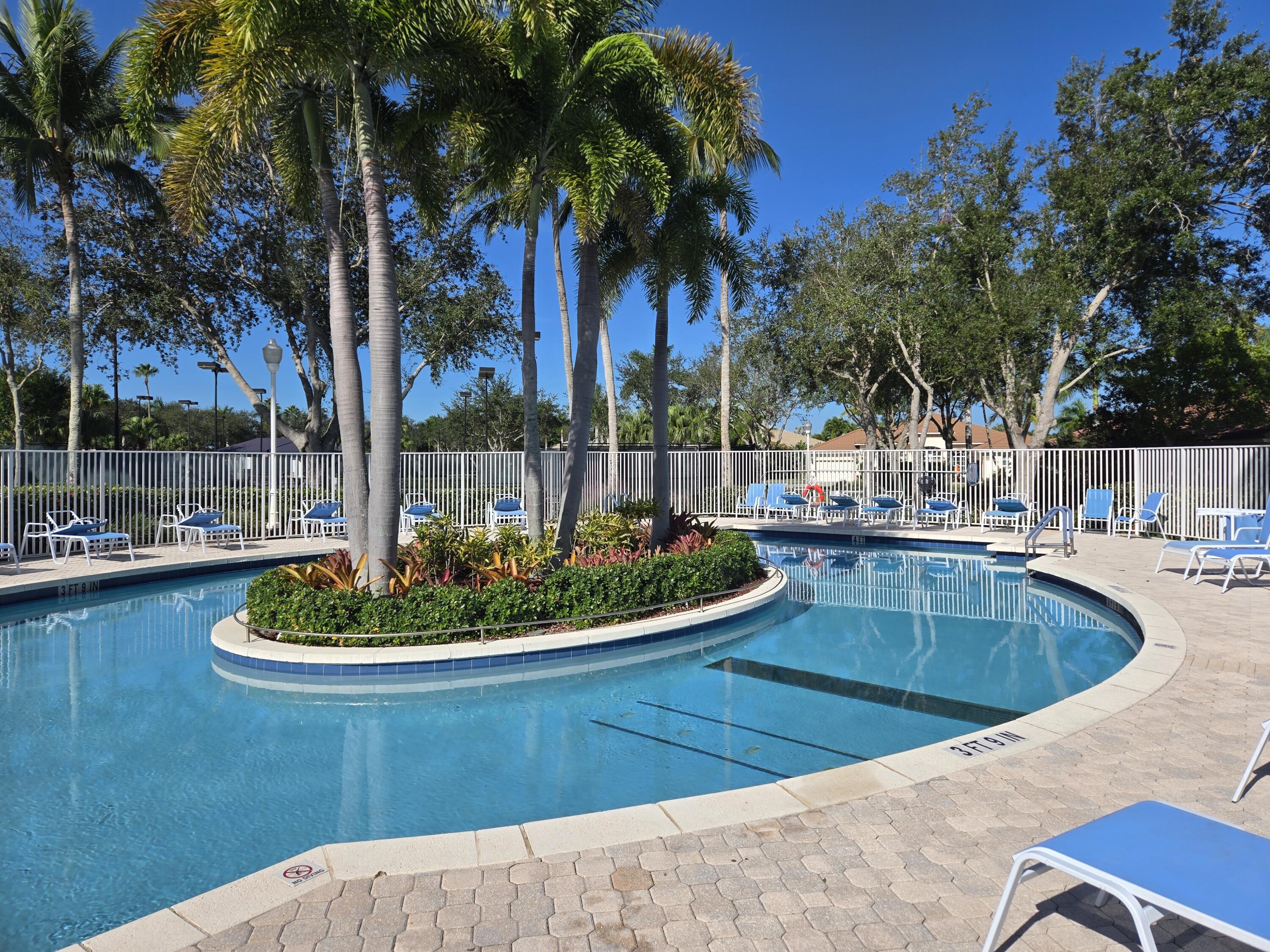 2297 Windjammer Way West Palm Beach, FL 33411 - Photo 44 of 56 a view of a swimming pool with a patio