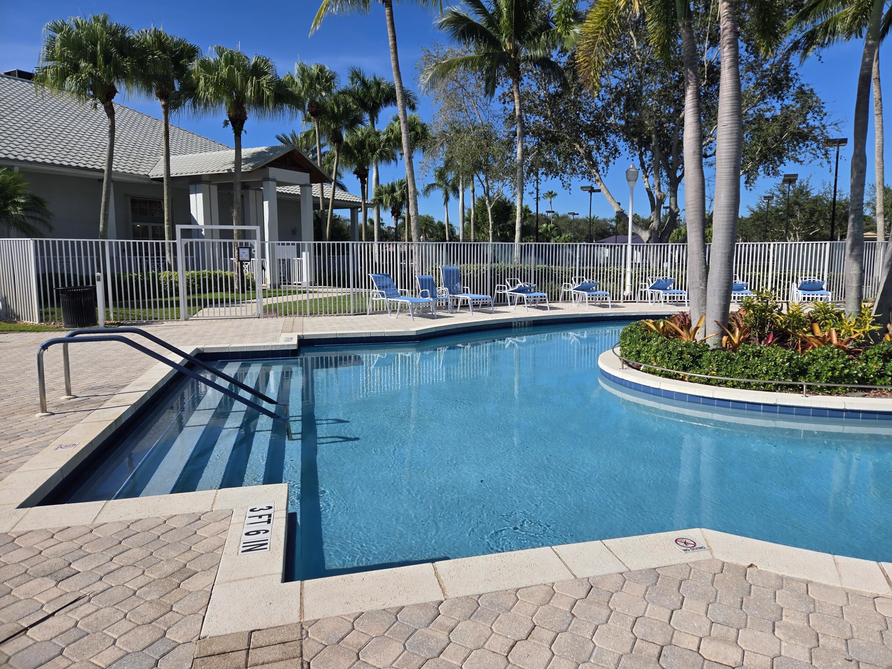 2297 Windjammer Way West Palm Beach, FL 33411 - Photo 45 of 56 a view of a backyard and swimming pool