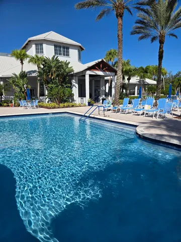 a view of a patio with a table and chairs in the patio