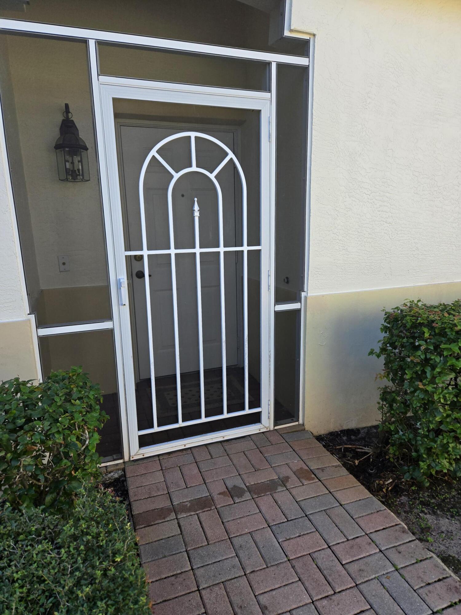 2297 Windjammer Way West Palm Beach, FL 33411 - Photo 8 of 56 Screen Entry Door