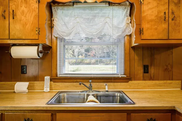 a view of a sink and a window