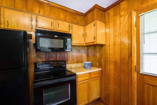 a kitchen with a stove and a microwave