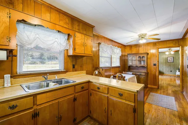 a kitchen with a sink and a window