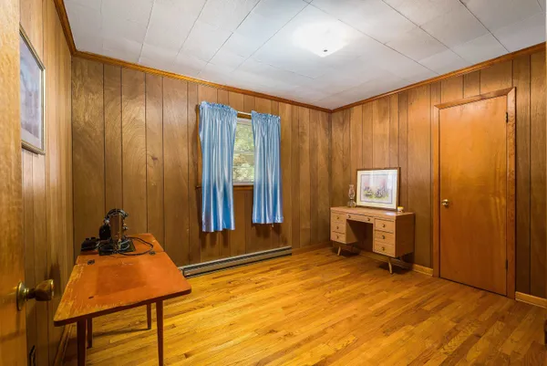 a room with a bed and a chair