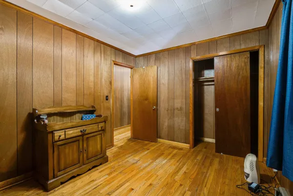 a view of a kitchen with wooden floor and furniture