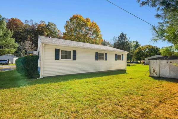 a view of a house with a yard
