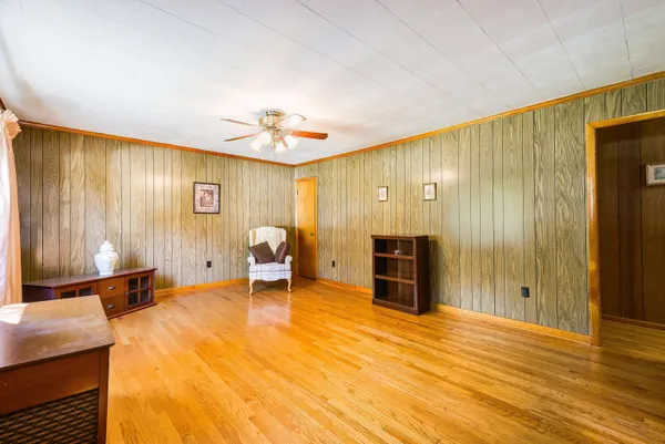 a view of a livingroom with furniture and a window