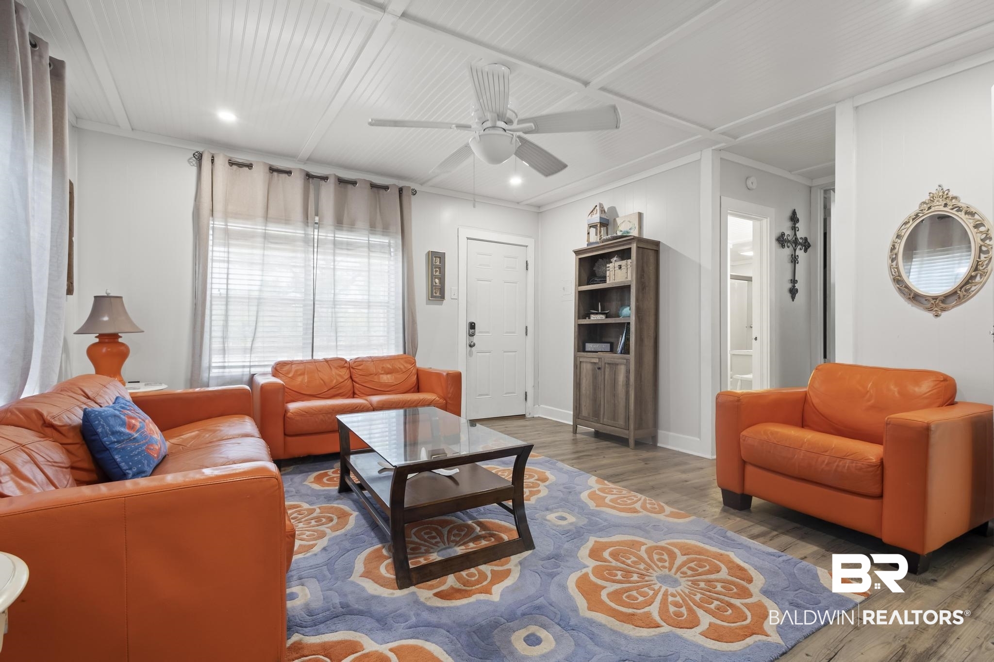 562 Veterans Road Gulf Shores, AL 36542 - Photo 11 of 32 Living area featuring wood finished floors, a ceiling fan, recessed lighting, ornamental molding, and baseboards