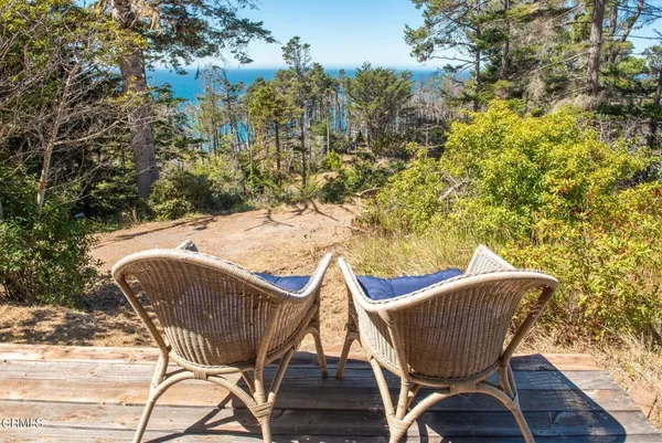 a view of a chairs and table in the patio
