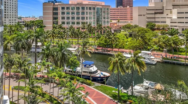 a view of a tall building in the backyard