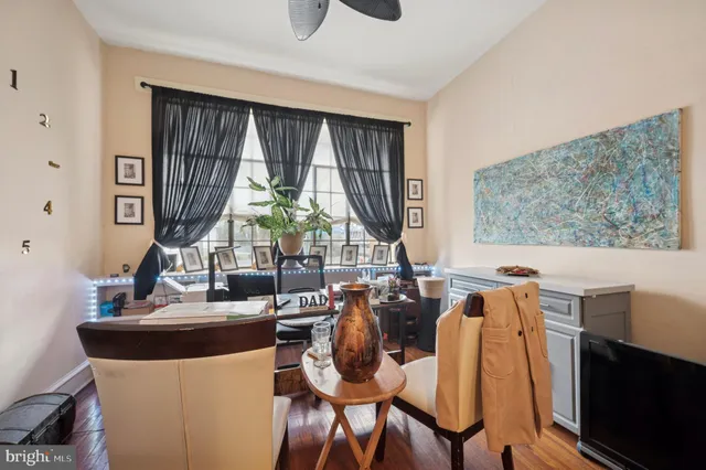 a dining room with furniture a window and a chandelier
