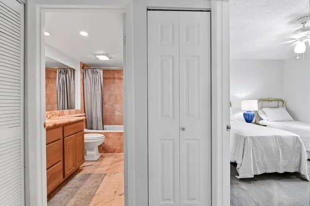 a bathroom with a toilet sink and shower
