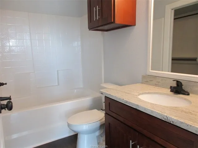 an empty room with wooden floor