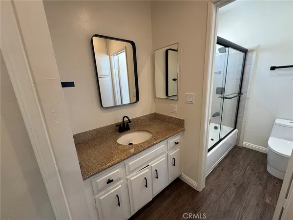 a bathroom with 2 sink and a mirror