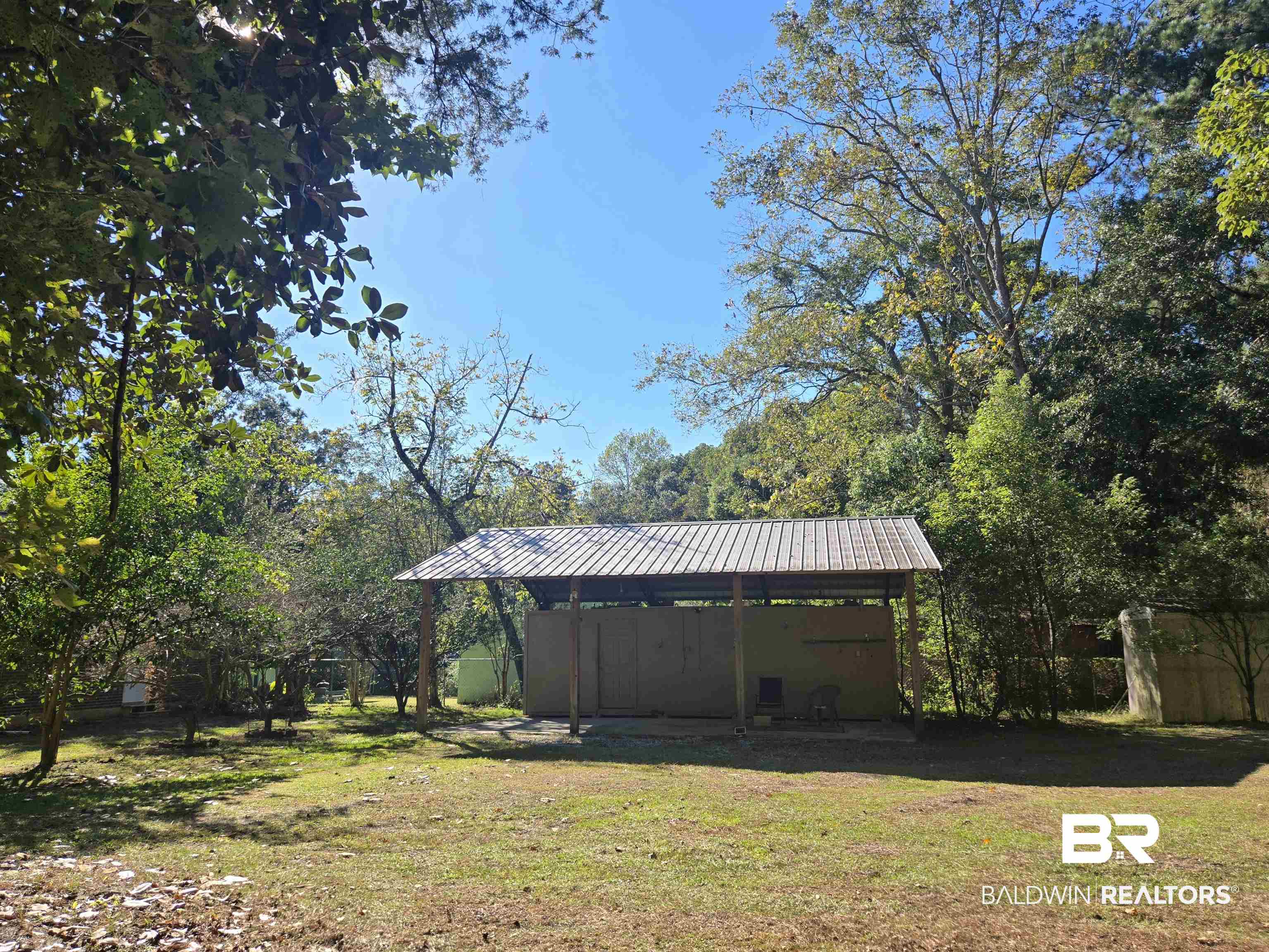 2554 Riverside Drive Mobile, AL 36605 - Photo 37 of 43 View of yard with a carport and view of scattered trees