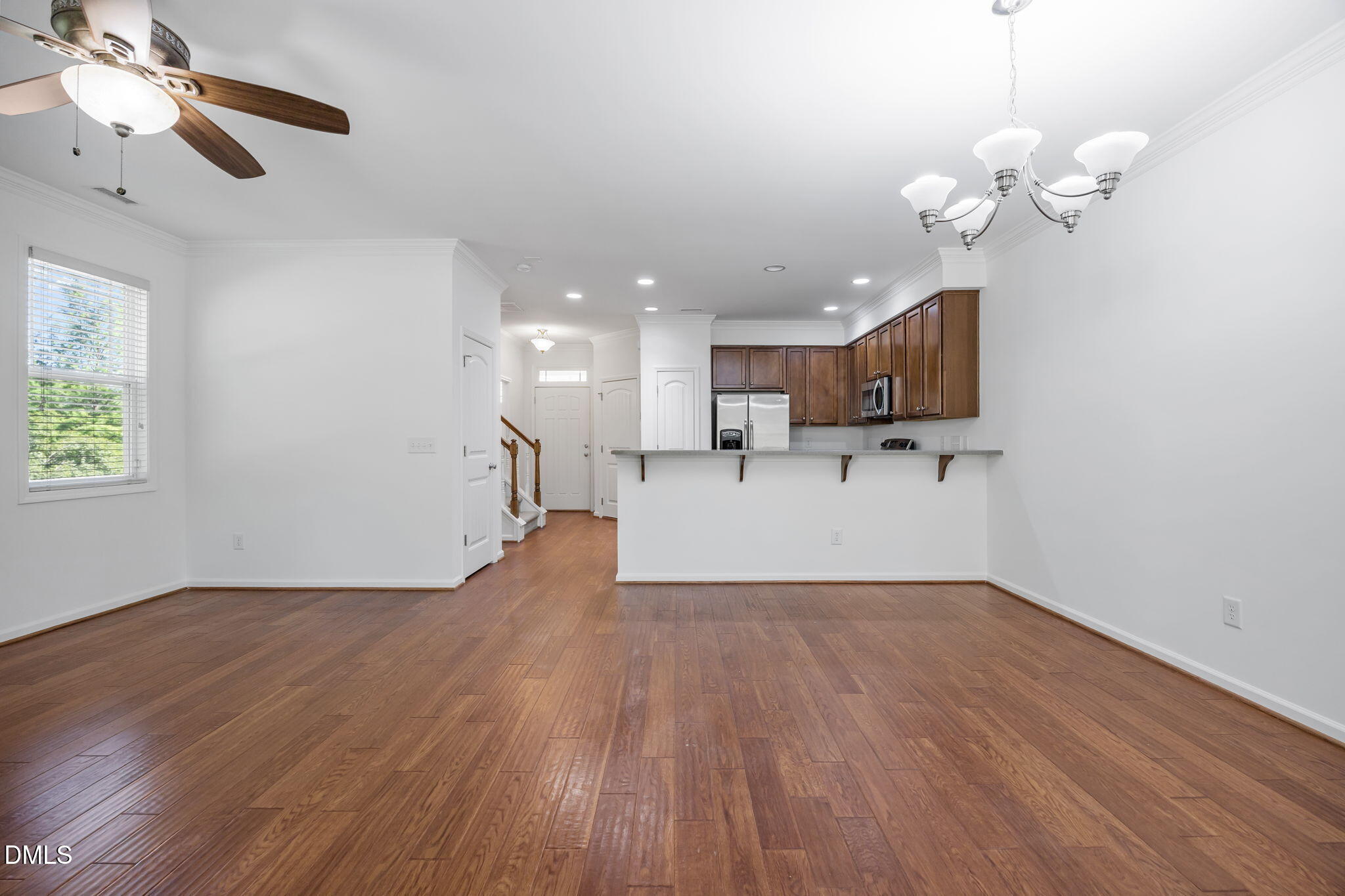 4724 Altha Street Raleigh, NC 27606 - Photo 19 of 43 a view of a house with wooden floor and a chandelier