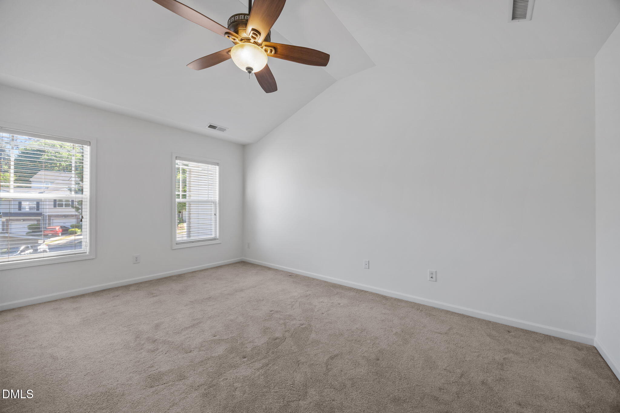 4724 Altha Street Raleigh, NC 27606 - Photo 25 of 43 an empty room with windows and fan