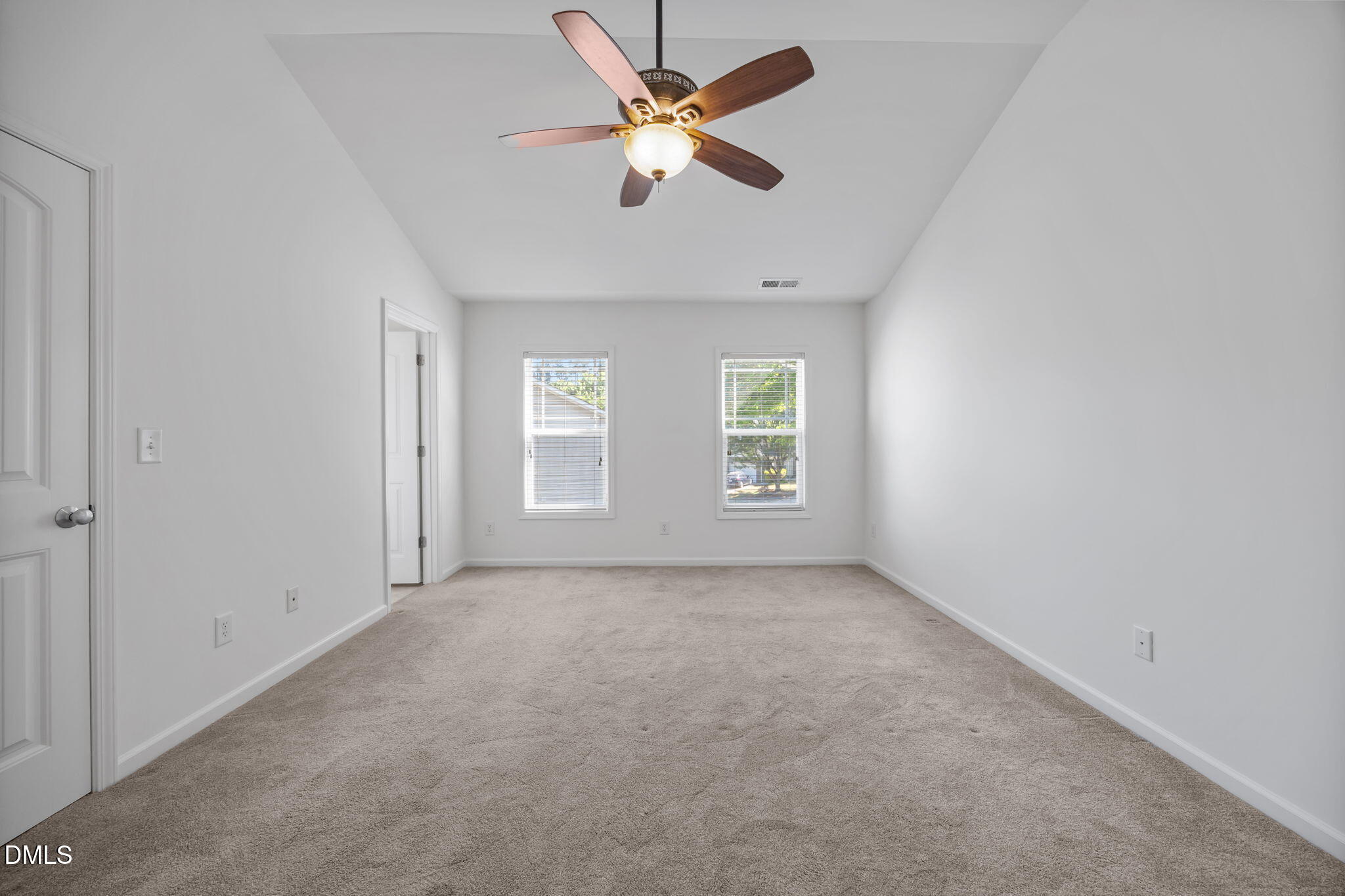 4724 Altha Street Raleigh, NC 27606 - Photo 26 of 43 an empty room with windows and fan