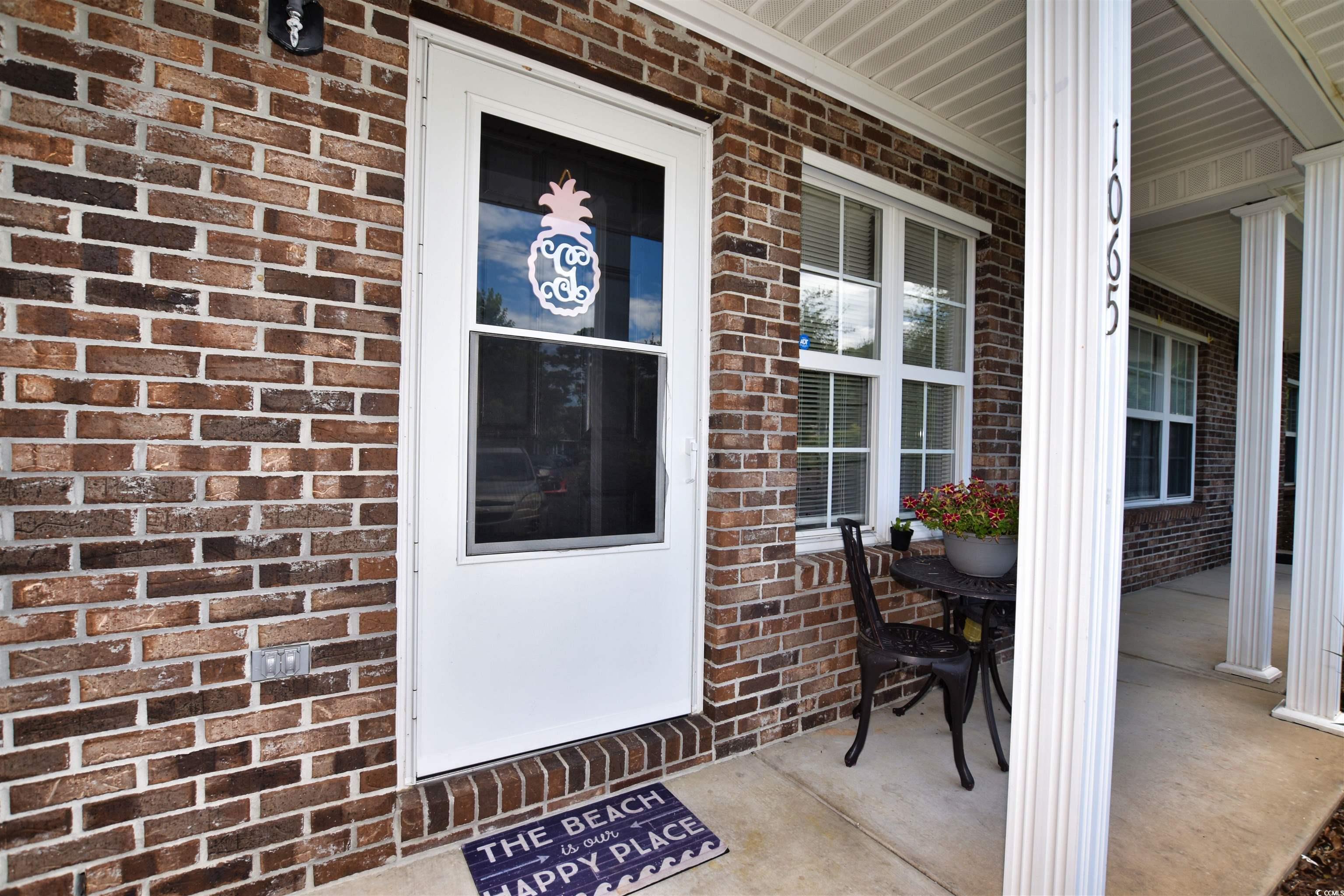 1065 Pinwheel Loop, Unit 1065 Myrtle Beach, SC 29577 - Photo 2 of 27 Property entrance with covered porch