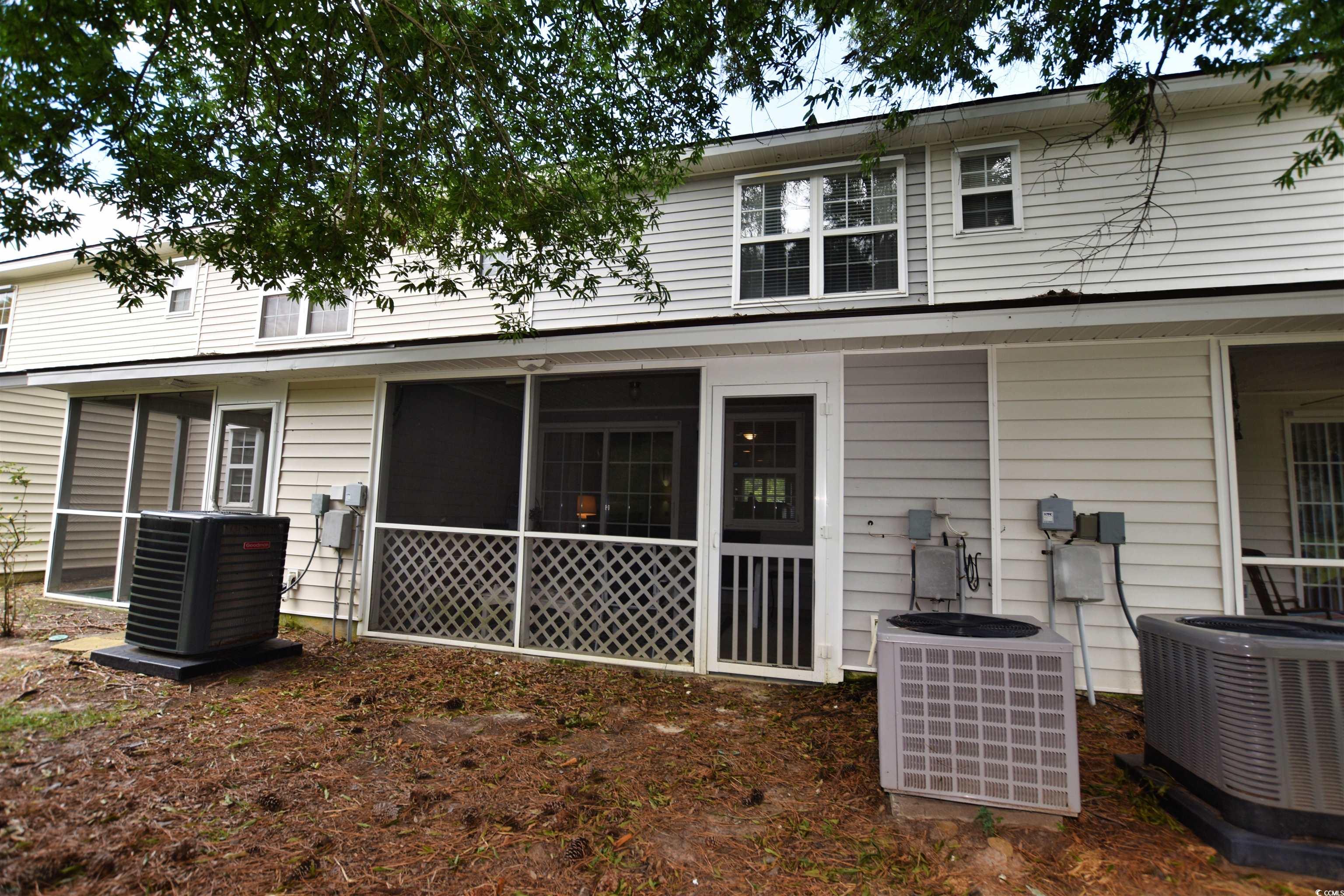 1065 Pinwheel Loop, Unit 1065 Myrtle Beach, SC 29577 - Photo 24 of 27 Rear view of property with central AC