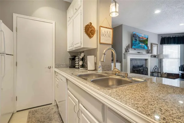 a bathroom with a sink a vanity and a mirror