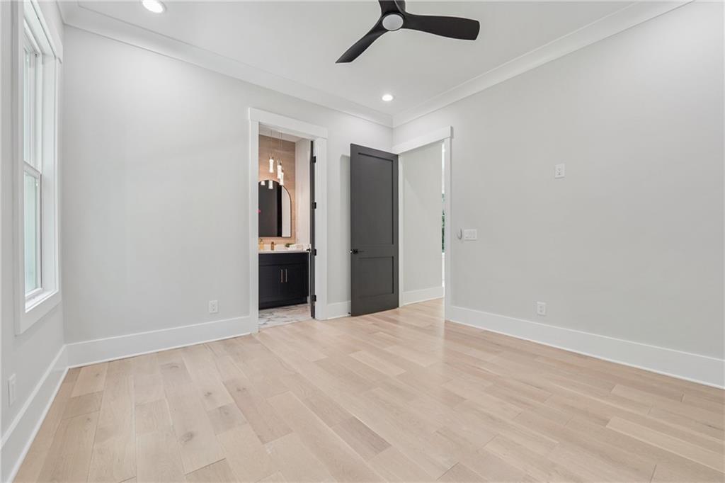 333 Sims Bridge Road Commerce, GA 30530 - Photo 28 of 71 an empty room with chandelier fan and windows